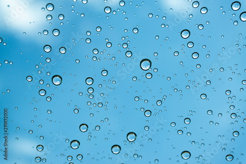 Rain on the window, natural skin of the rain The natural form of rainwater on a sky background.