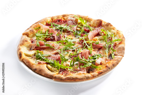 Tasty parma ham and artichoke pizza closeup