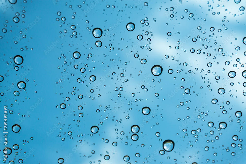 Rain on the window, natural skin of the rain The natural form of rainwater on a sky background. Rain on the window, natural skin of the rain The natural form of rainwater on a sky background.