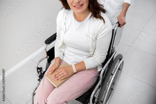 Happy woman on invalid carrige stock photo photo