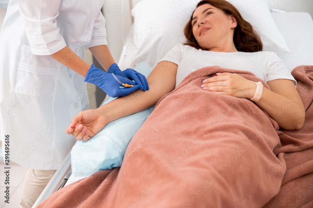 Medic is making procedures for female patient Medic is making procedures for female patient