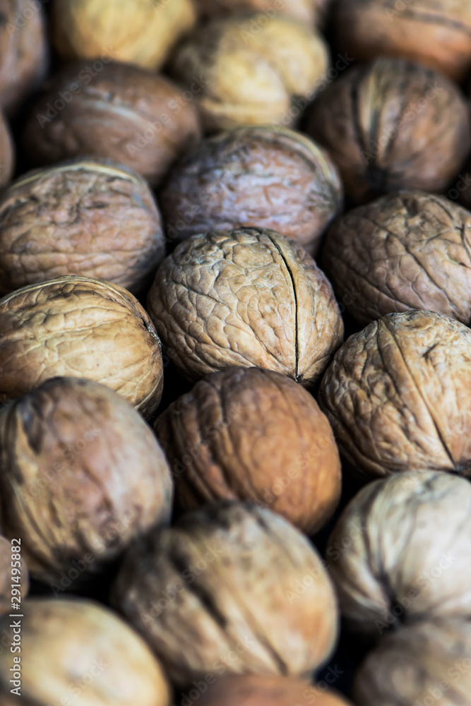 whole unpeeled brown nuts background whole unpeeled brown nuts background