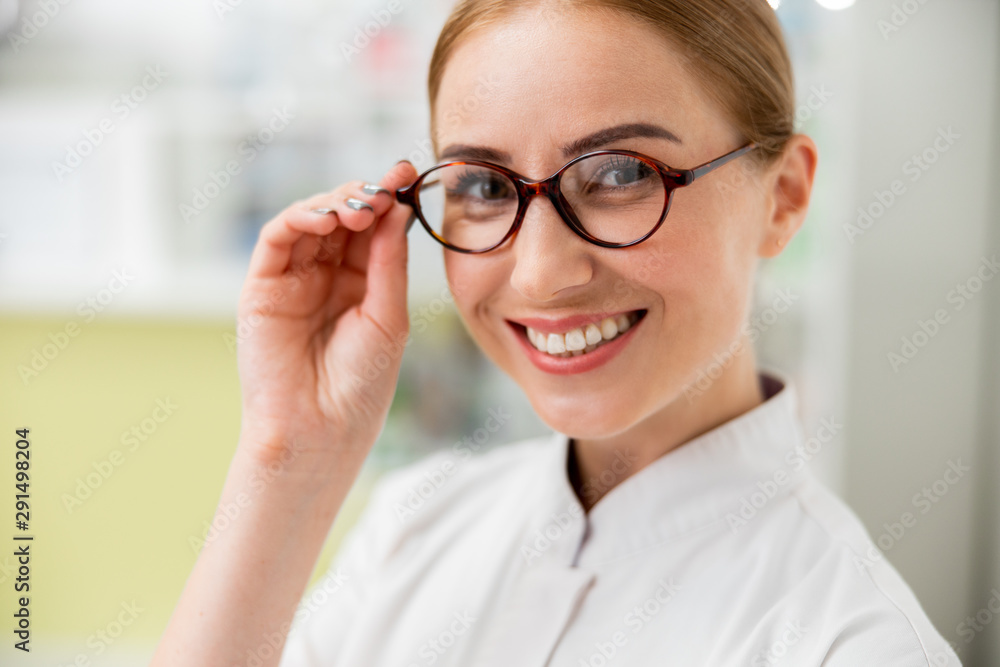 Smiling female doctor is working in clinic