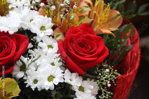 Colorful bouquet with roses and daisies