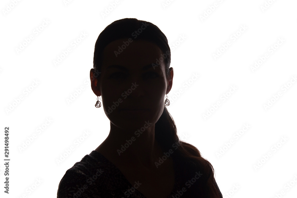 Young woman look ahead with lock of hair - silhouette