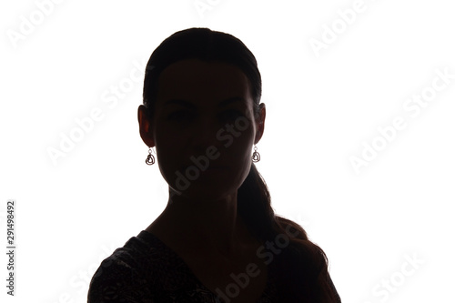Young woman look ahead with lock of hair - silhouette