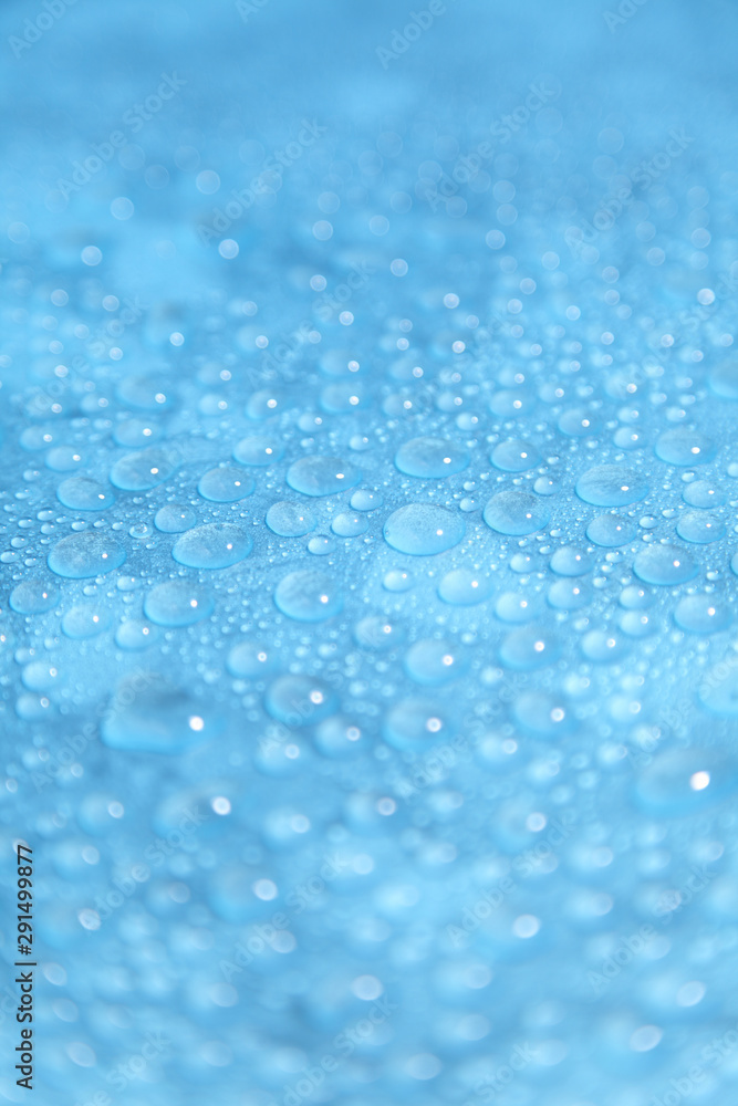 Close up water drops on blue background, Water drop in macro photography