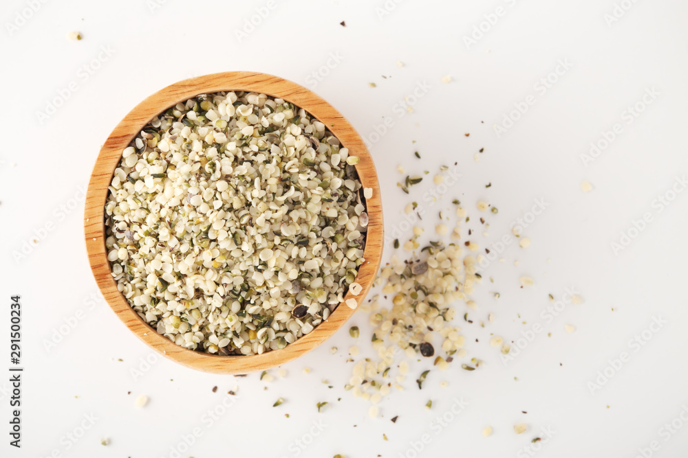 Hemp seeds in wooden bowl, top view Hemp seeds in wooden bowl, top view