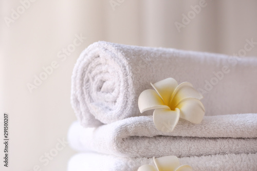 Clean towels with flowers, closeup