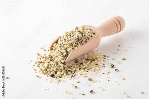 Hemp seeds on wooden scoop photo