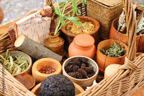 Various dried meadow herbs and herbal tea in the basket.