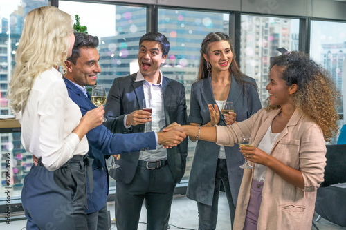 Merry Christmas and Happy New Year. Many young races group, talk and introduce yourself to the party, celebrate success or Eve, Christmas or New Year's Eve.