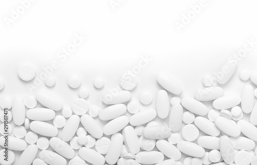 White pills (tablets) background.