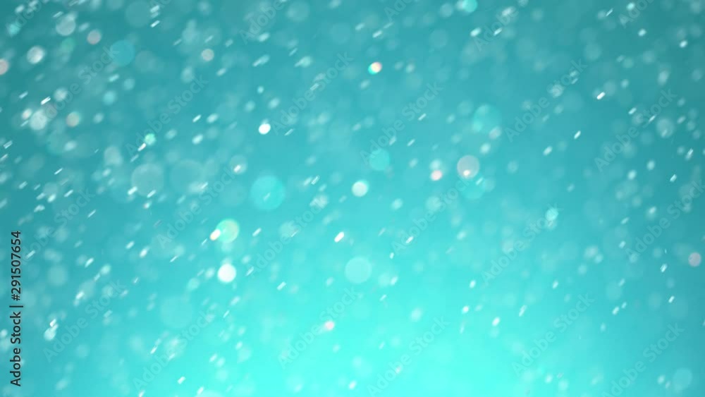 Super slow motion of glittering blue particles. Shallow depth of focus. Filmed on high speed cinema camera, 1000 fps. Super slow motion of glittering blue particles. Shallow depth of focus. Filmed on high speed cinema camera, 1000 fps.