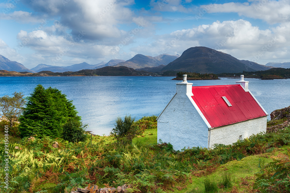 A pretty croft with a red roof looking out over Loch Shieldaig A pretty croft with a red roof looking out over Loch Shieldaig