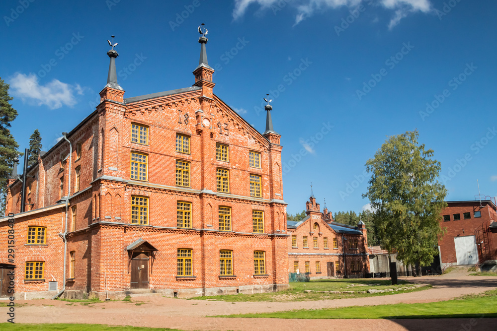 Fototapeta premium Kouvola, Finland - 2 September 2019: The Verla Mill museum Groundwood and Board Mill at Jaala, Kouvola, Finland, is a well preserved 19th century mill village and a UNESCO World Heritage site.