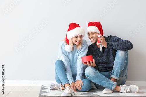 Happy couple in Santa hats ...