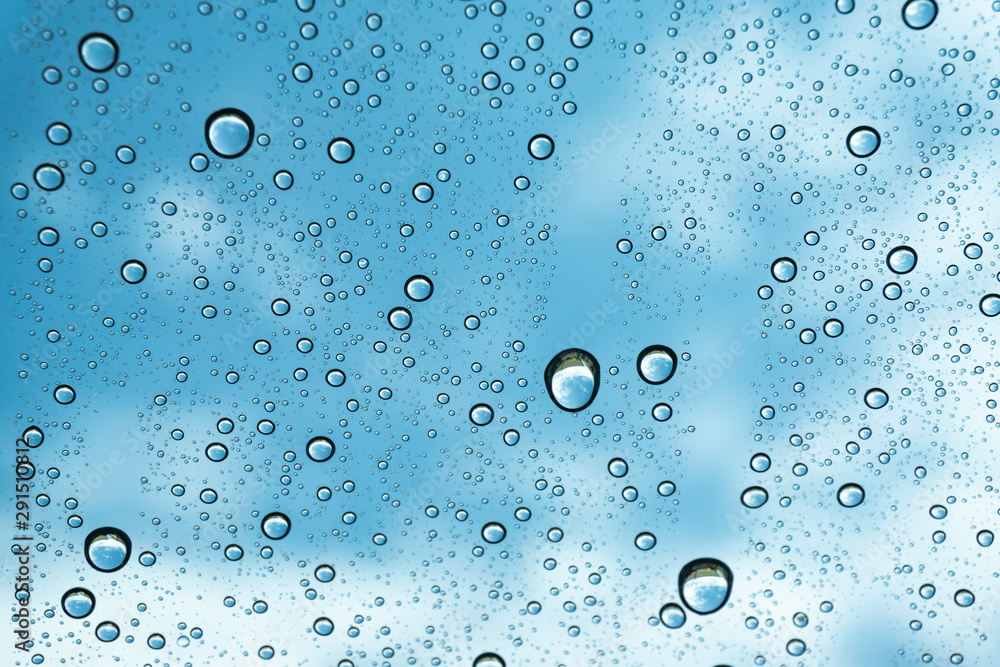Rain on the window, natural skin of the rain The natural form of rainwater on a sky background.