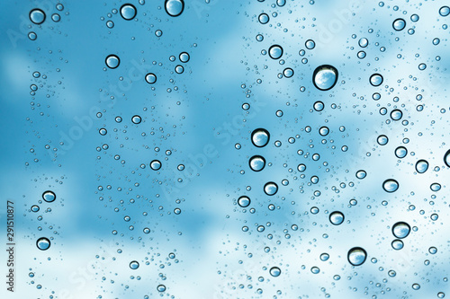 Rain on the window, natural skin of the rain The natural form of rainwater on a sky background.