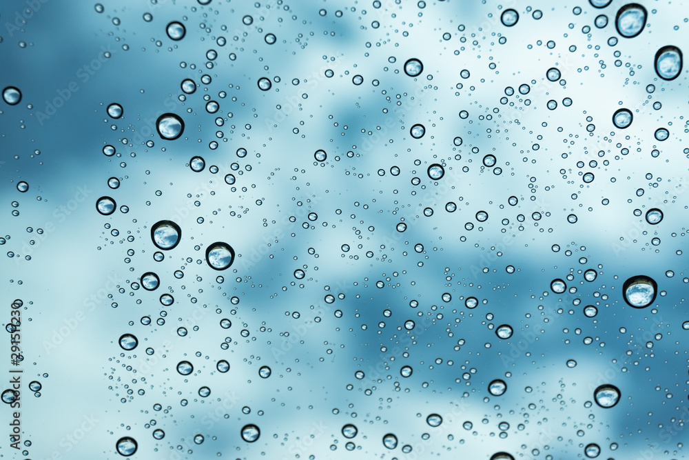 Rain on the window, natural skin of the rain The natural form of rainwater on a sky background.