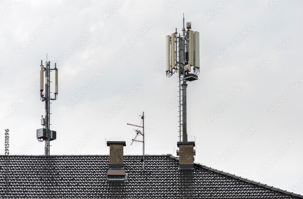 5G antennas on top of house. Antennas and transmitters on roof.