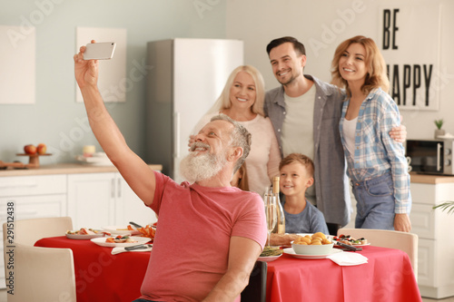 Mature man taking photo wit...