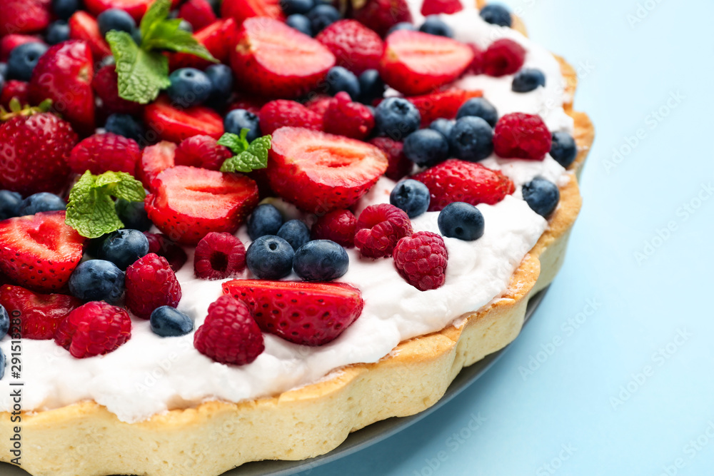 Tasty berry pie on color background, closeup Tasty berry pie on color background, closeup