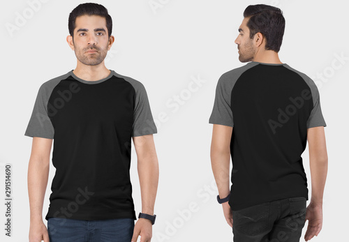 Front and back view of handsome male model wearing black and grey plain raglan t shirt in dark blue denim jeans pant. Isolated background.