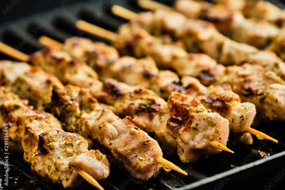 Cooking souvlaki on grill