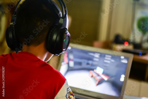 Young boy addicted to computer.