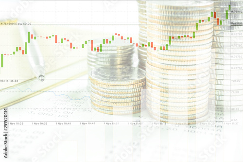 Concept of currency trading, making a decision for an optimal gain. Graph and rows of coins for finance and business concept.