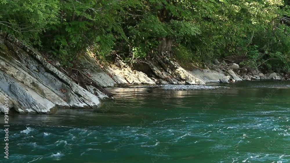 Mountain landscape with rocky coast river and forest Mountain landscape with rocky coast river and forest