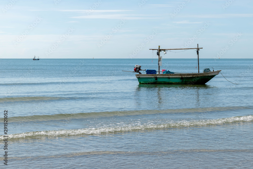 Small fishing boats parked on the beach.