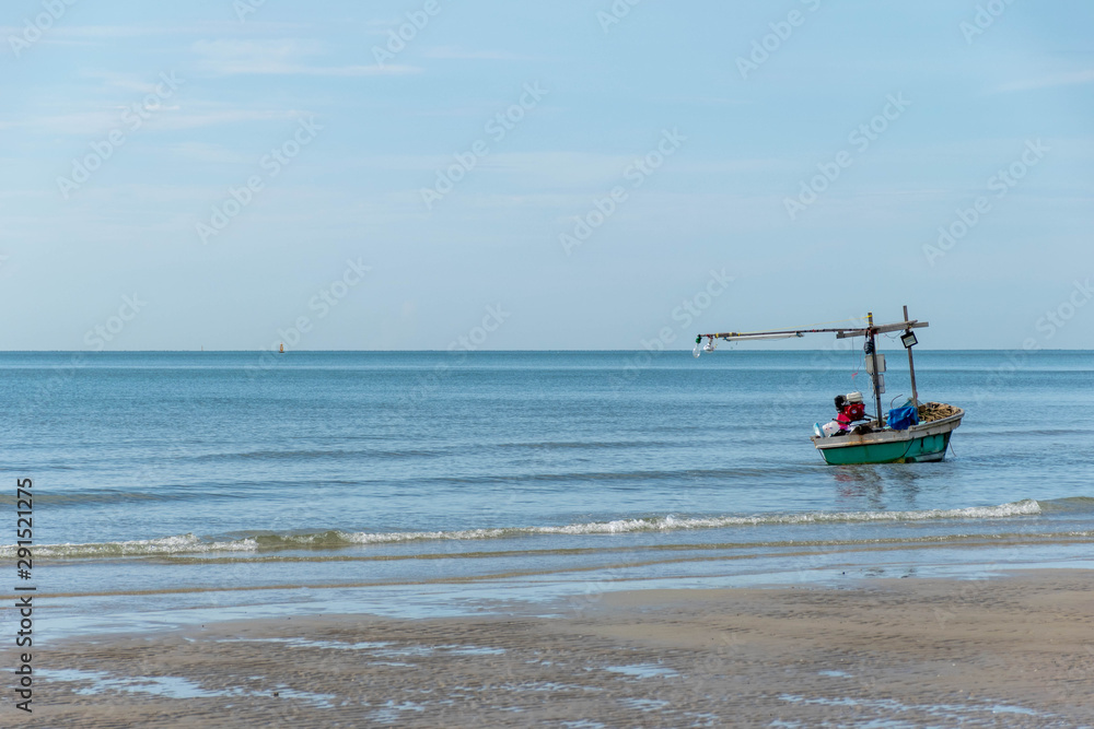 Small fishing boats park on the beach