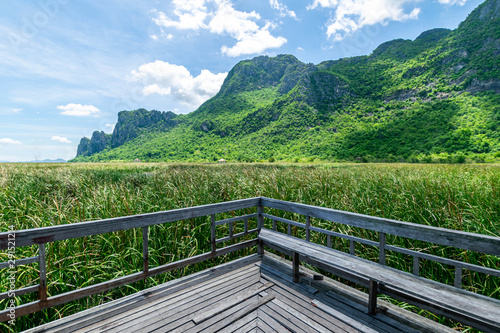 Wooden bridge over a lake with blue sky in Sam Roi Yod National Park, Prachuap Khiri Khan, Thailand