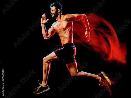 one caucasian topless muscular mature man runner. running jogger jogging isolated on black background with light painting speed mouvement effect © snaptitude