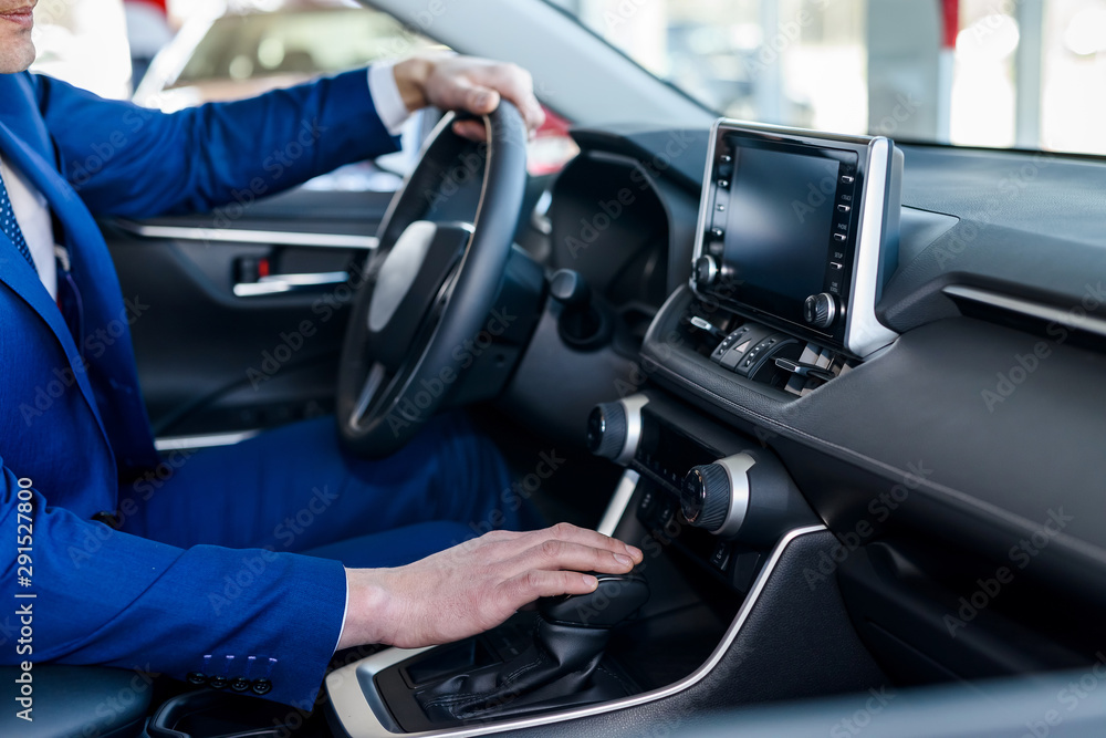 Male hands on steering wheel, car interior Male hands on steering wheel, car interior