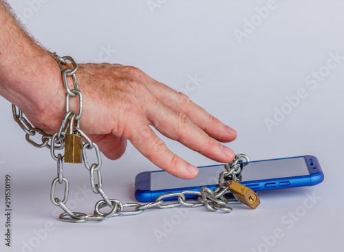 Concept of smartphone addiction /Abusing your mobile phone creates a real addiction called nomophobia, a fear of being disconnected  from the world