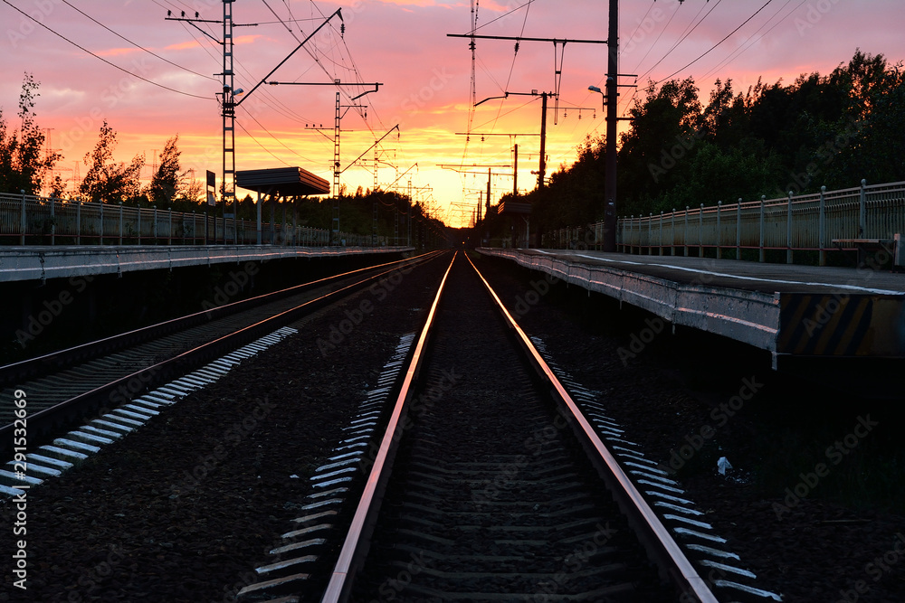 railway track, sunset as background