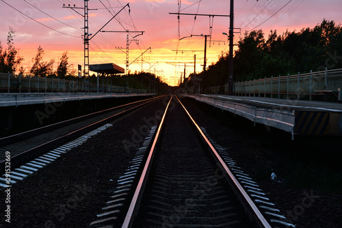 railway track, sunset as background © Olga