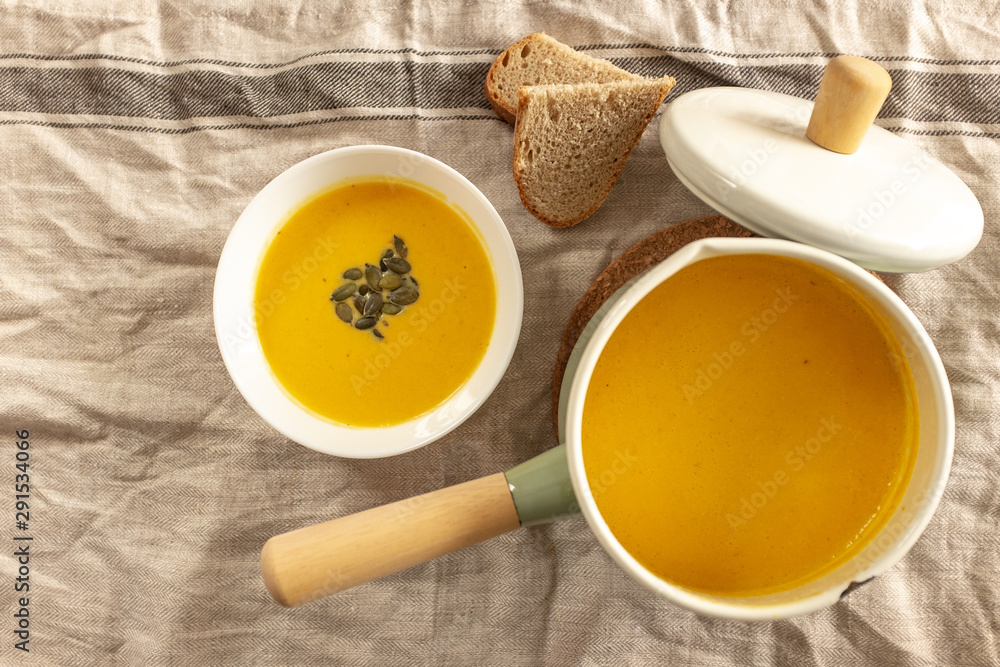 pumpkin cream soup with pumpkin seeds and bread pumpkin cream soup with pumpkin seeds and bread