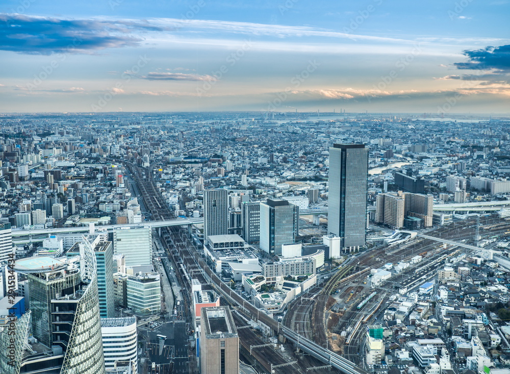 Fototapeta premium Beautiful aerial view of Nagoya city in Japan with tall buildings and blue skies