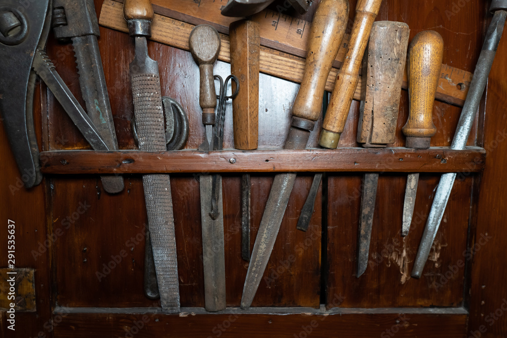 Old tools inside a drawer. Wooden