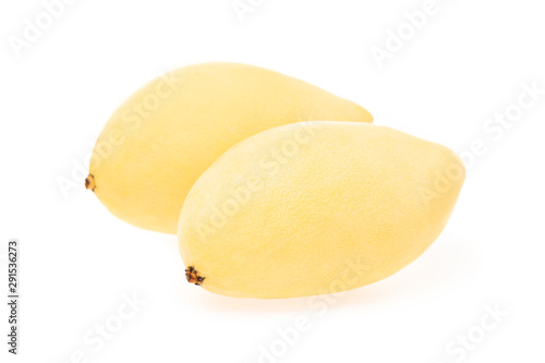 Closeup image of two fresh thai mango isolated at white background.