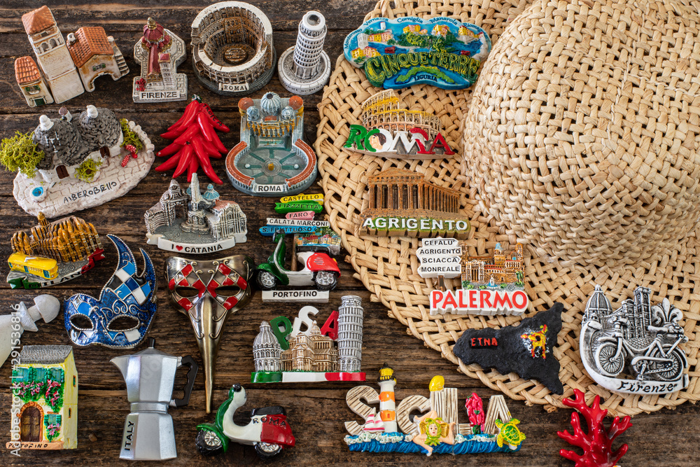 Many souvenirs from Italy on the wooden table, vacation concept