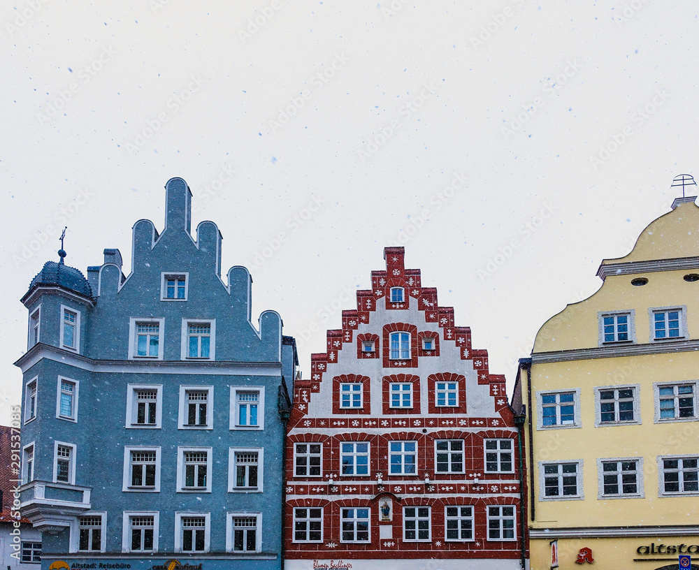 LANDSHUT, GERMANY: View of the famous Colorful ancient Buildings in the historic Center of Landshut in Bavaria in the snow