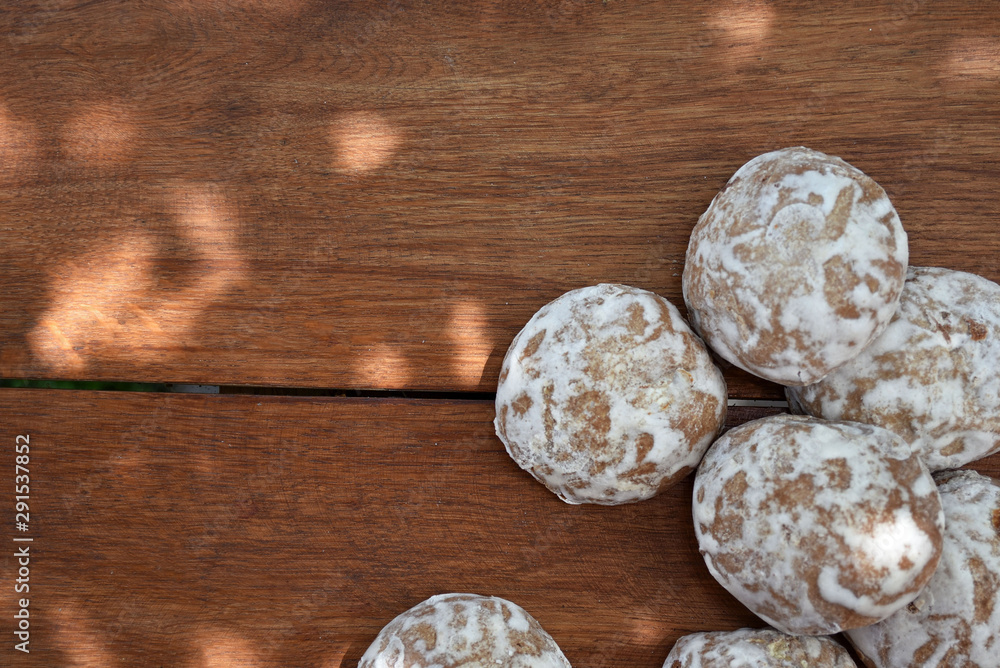 Heap of honey-cake on wooden table. Russian spice-cakes with frosting with copy space for your text, top view. Heap of honey-cake on wooden table. Russian spice-cakes with frosting with copy space for your text, top view.