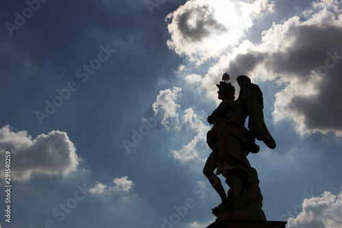 Silhouette of Angel with the Superscription  with bird on head   Ponte Sant Angelo - Rome  Italy
