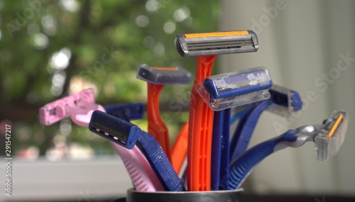 Bunch of old disposable razors. The problem of plastic pollution of the earthn photo
