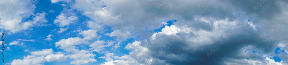 Fototapeta premium panorama of sunset blue sky with cirrus clouds